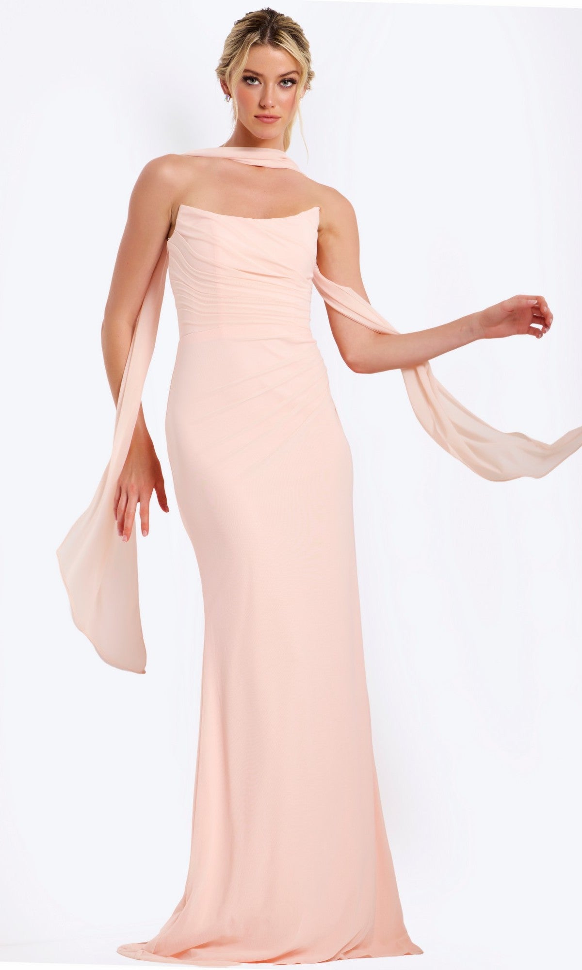 A woman wears the Jovani 47874 long prom dress in blush, a strapless chiffon gown with a matching scarf over her shoulders, standing against a plain white background.